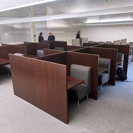 rows of wood study booths in quiet study room at MiraCosta College