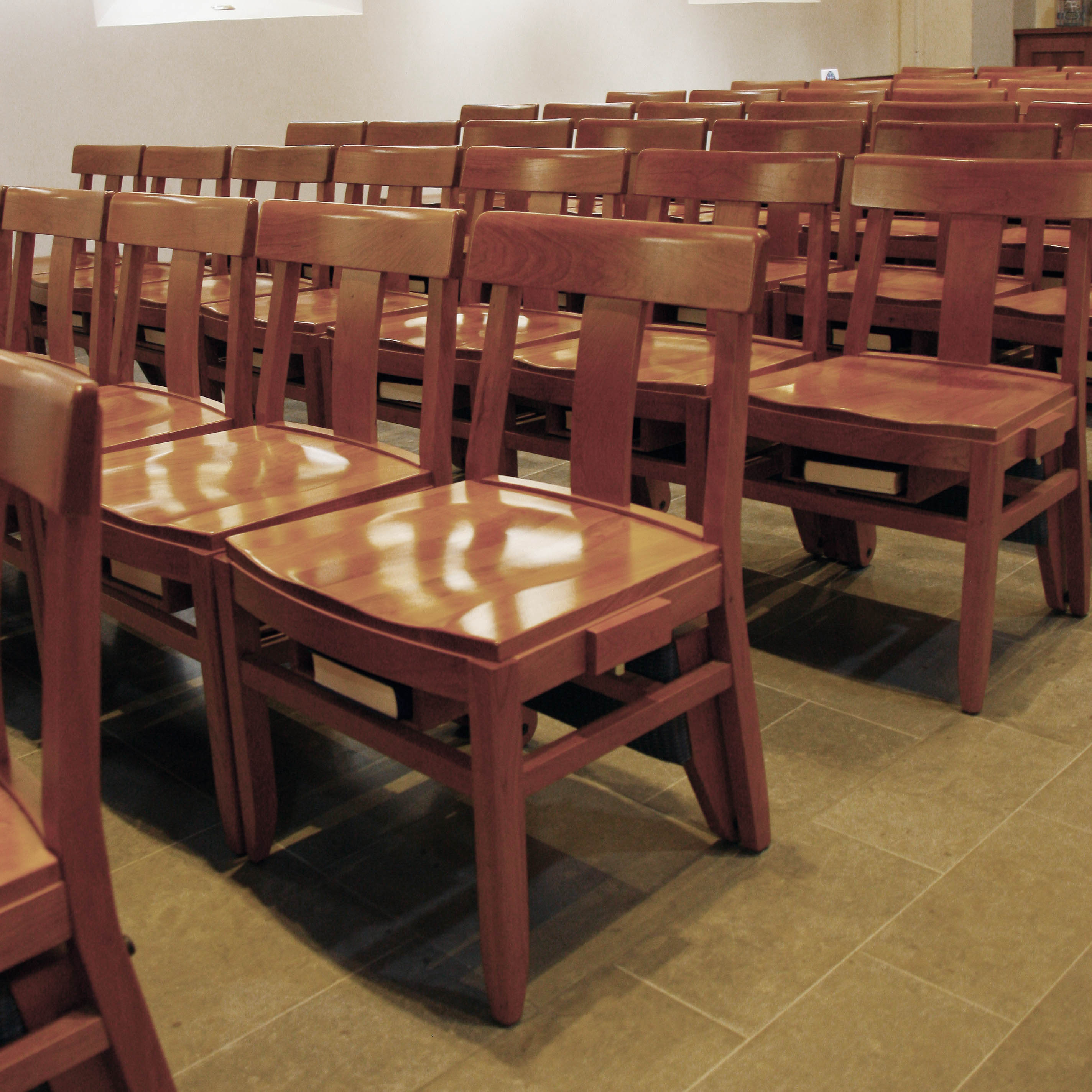 Wooden church chairs with kneelers