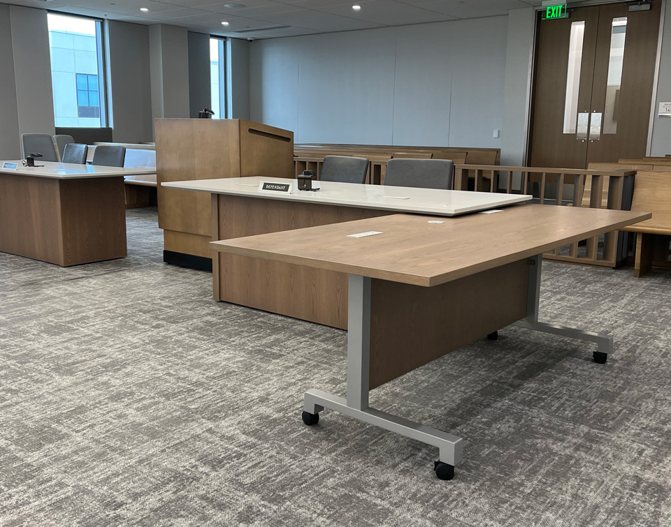 Custom courtroom furniture including flip top table for extra counsel space